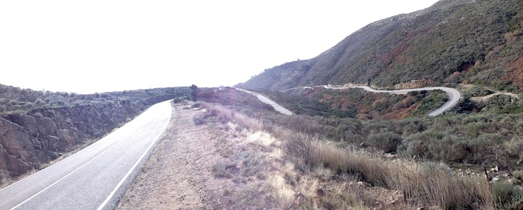 A long road, snaking back and forth down the mountainside, until it goes out of sight